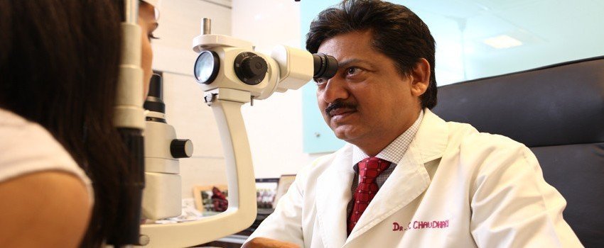 Dr. Chaudhary inspecting cornea of a woman