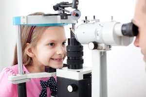 girl getting her eye checkup