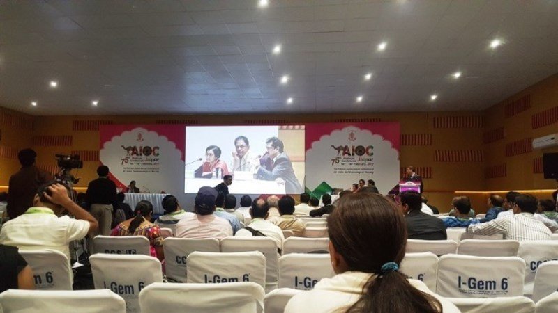 Dr. Chaudhary speaking at a conference in Jaipur