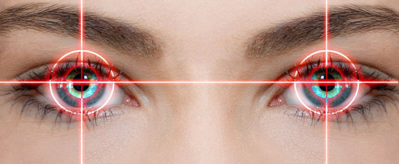 Laser beams are pointed on woman's eyes