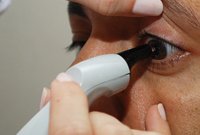 Patient's eye is tested by Pachymeter