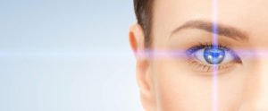 Focus of laser beam on a woman's eye